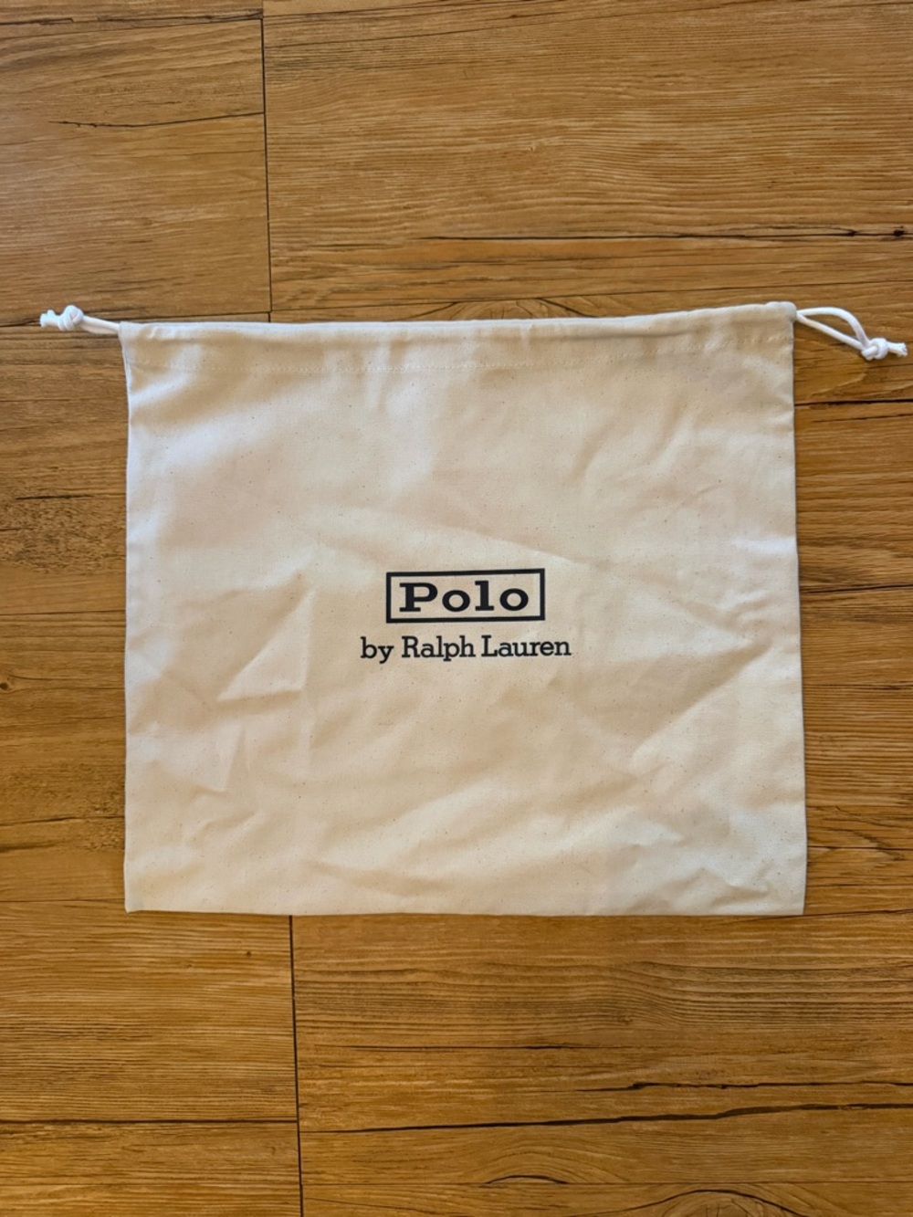 Authentic Polo Ralph Lauren dust bag in a neutral canvas with black logo detail